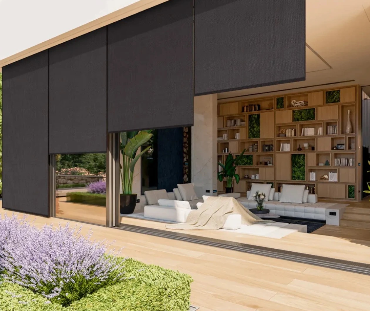 Dark exterior roller shades lowered across the glass walls of a modern home, one raised over an open living room